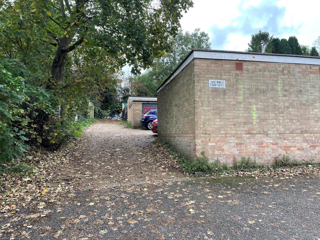 Lot: 43 - TEN VACANT LOCK-UP GARAGES - View of driveway to garages
